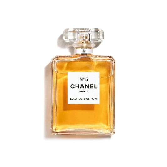 Chanel No. 5 perfume bottle on a white background The Style Hub